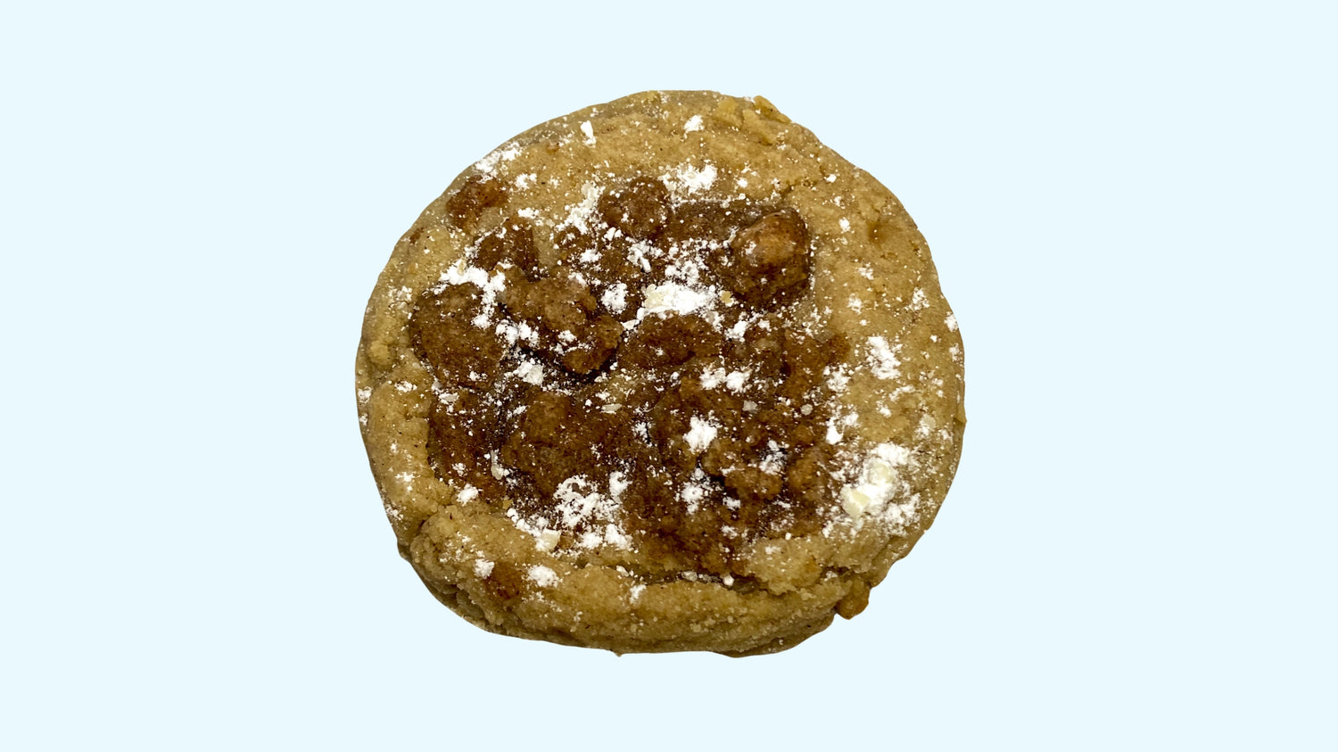 A gourmet coffee cake cookie, available for delivery. It is topped with streusel and powdered sugar.