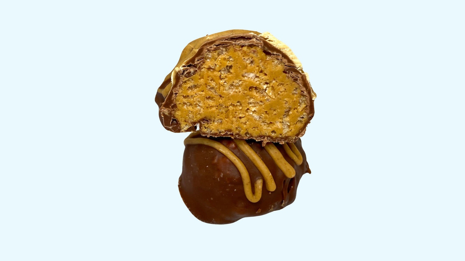 A gourmet giant stuffed truffle filled with peanut butter and rice crispies, ready for delivery.